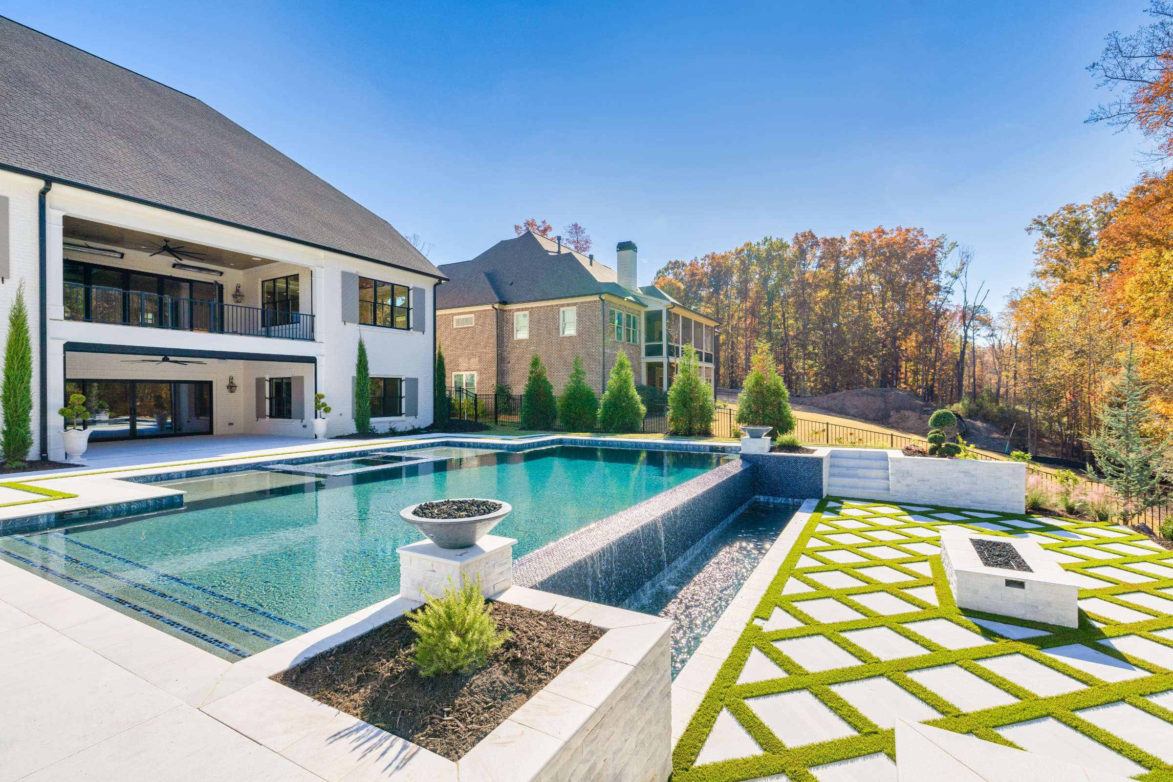 Custom geometric pool with integrated spa in Atlanta backyard
